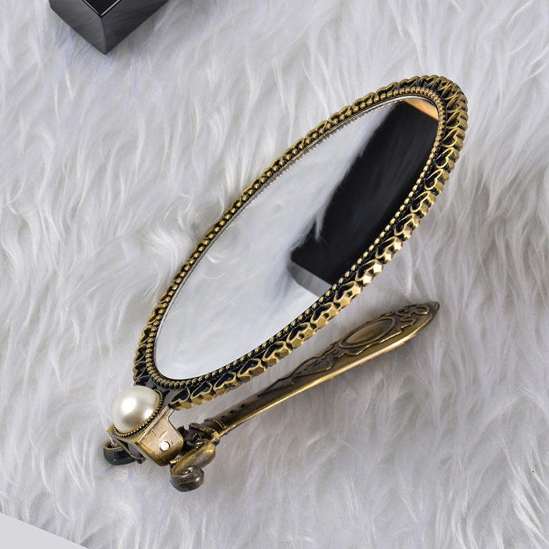 Metal makeup mirror creative bedroom portable folding mirror folding makeup mirror retro handheld mirror